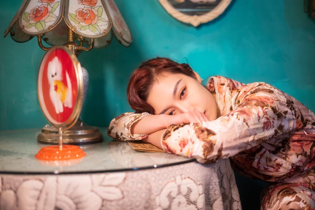 Young woman sitting by a table vintage portrait