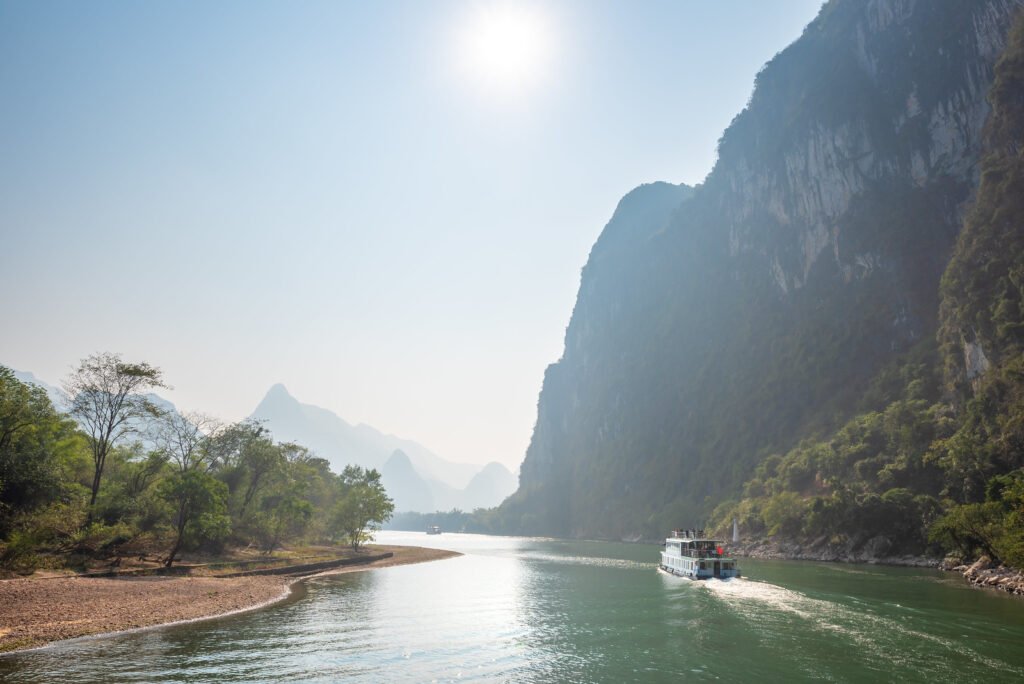Li River cruise with limestone karst hills landscape in Yangshuo China