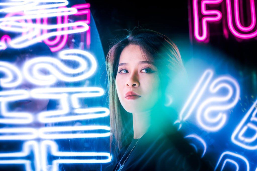 Young Chinese woman portrait with neon lights