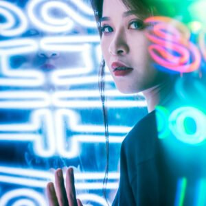 Young Chinese woman portrait with neon lights