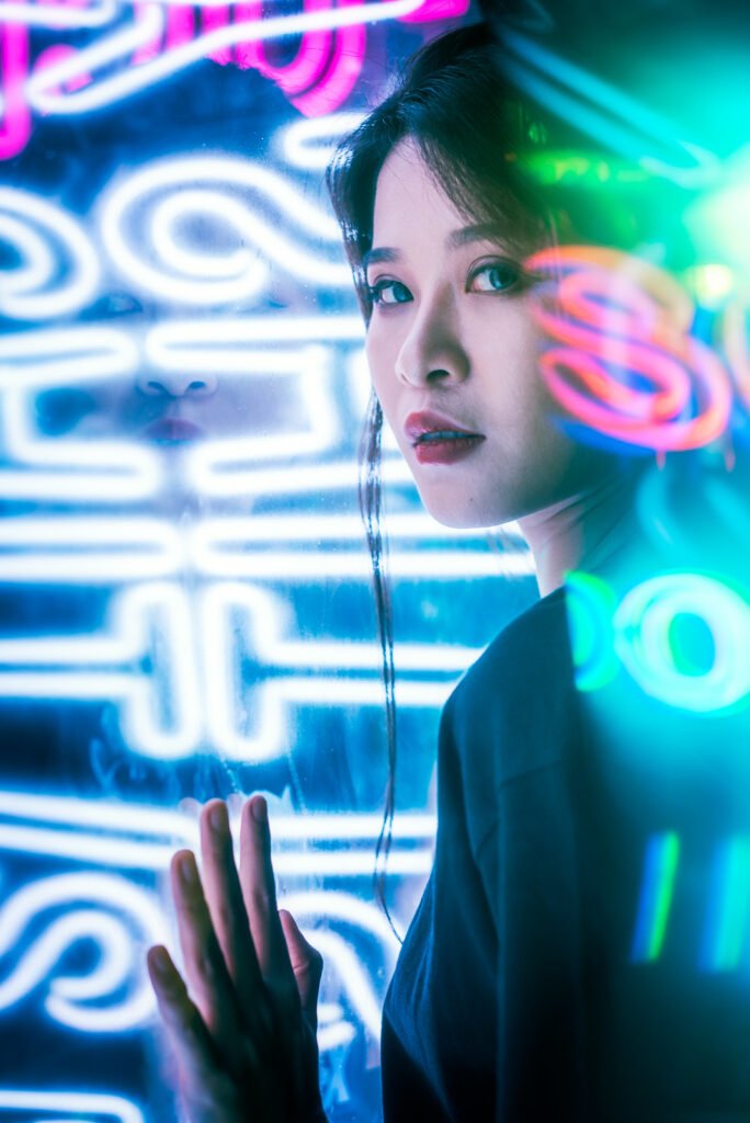 Young Chinese woman portrait with neon lights