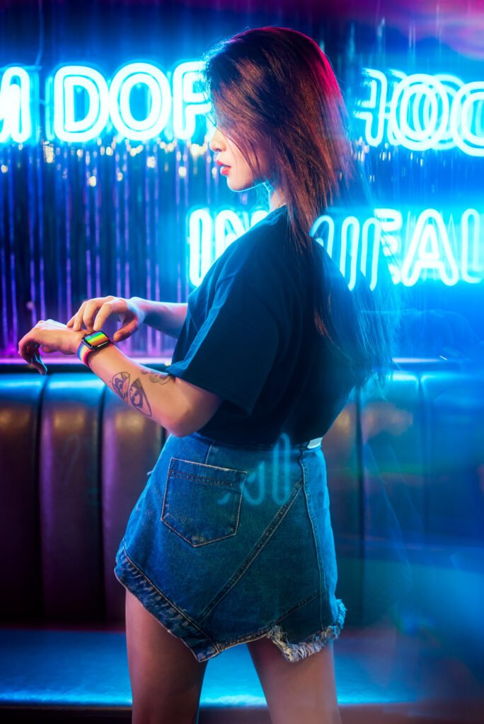 Young Chinese woman portrait with neon lights