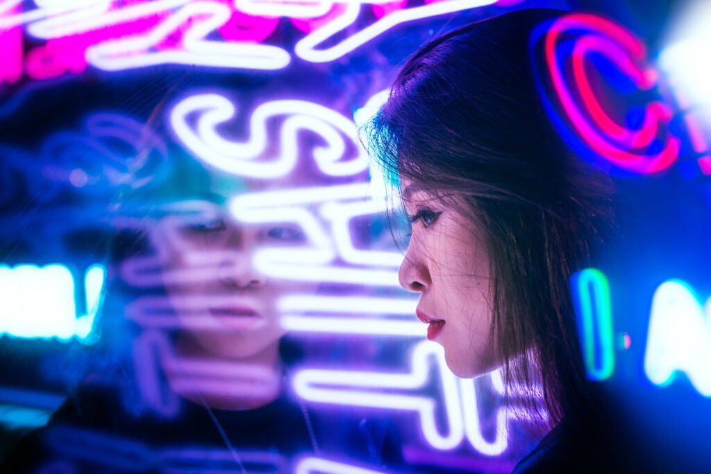 Young Chinese woman portrait with neon lights