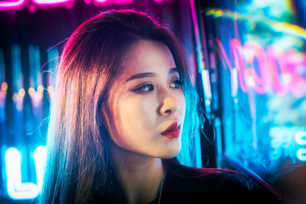 Young Chinese woman portrait with neon lights