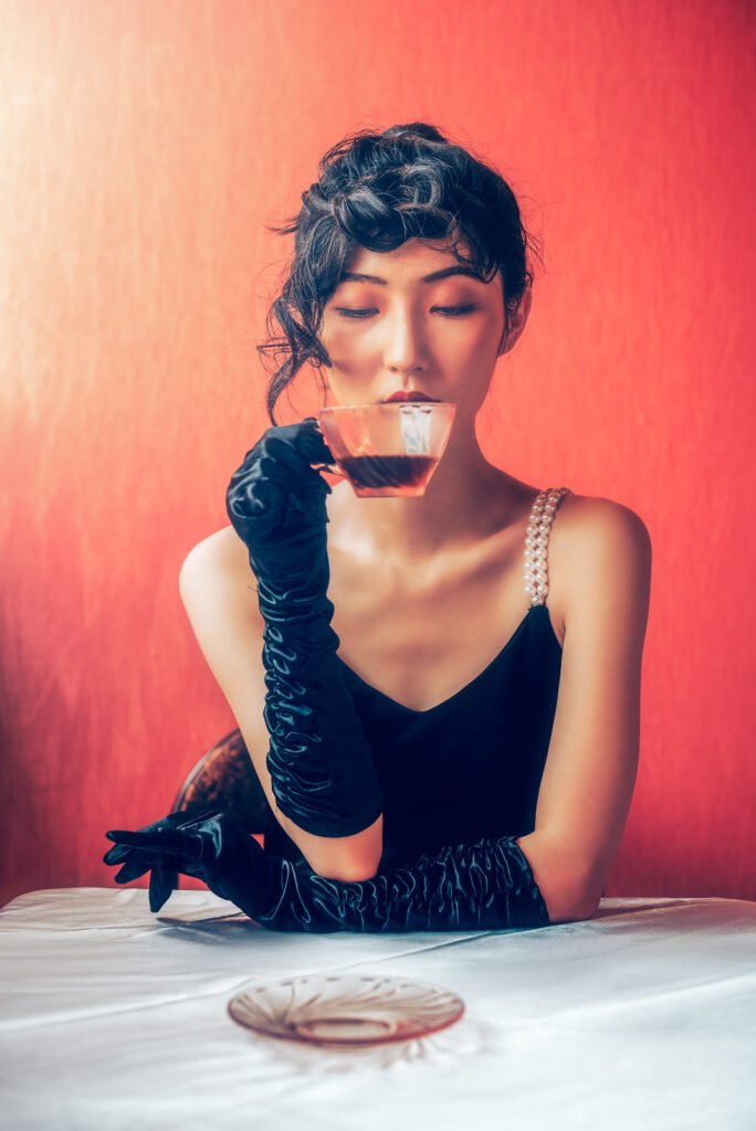 Young Chinese woman drinking coffee vintage portrait
