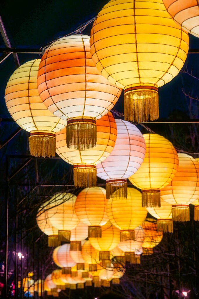 Yellow Chinese lanterns illuminated at night