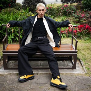 Portrait of a young Asian man in a park