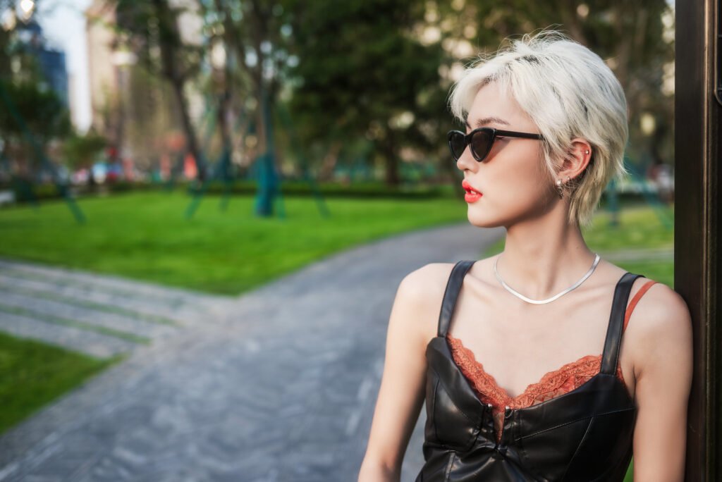 Portrait of a stylish young woman in an urban park