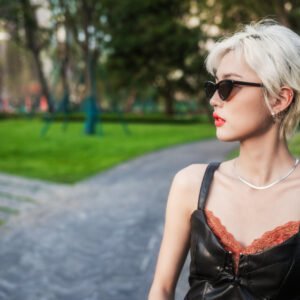 Portrait of a stylish young woman in an urban park