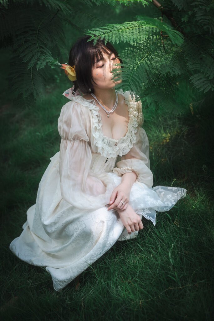 A beautiful young woman in a white dress