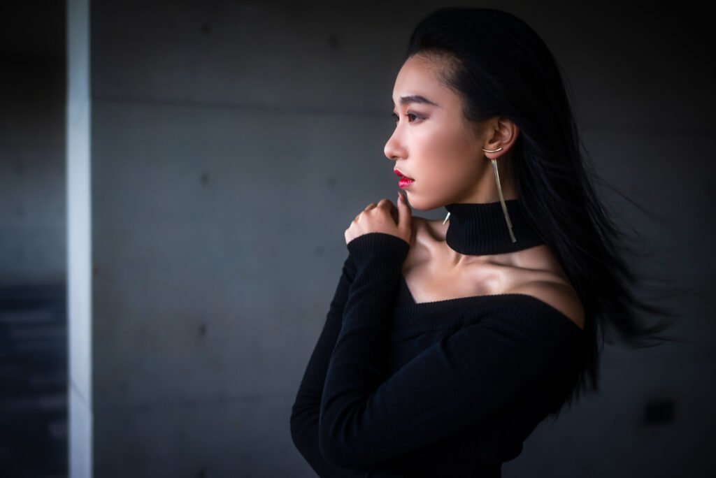 Young woman wearing a black dress portrait