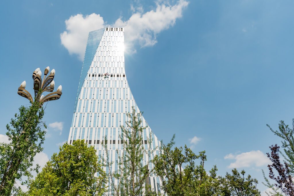 Chengdu CCEC building and lamppost against blue sky