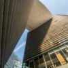 Modern curved buildings against clear blue sky