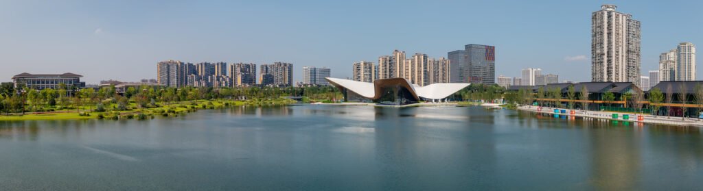 Chengdu Tianfu Art Museum reflecting in a lake in day panorama