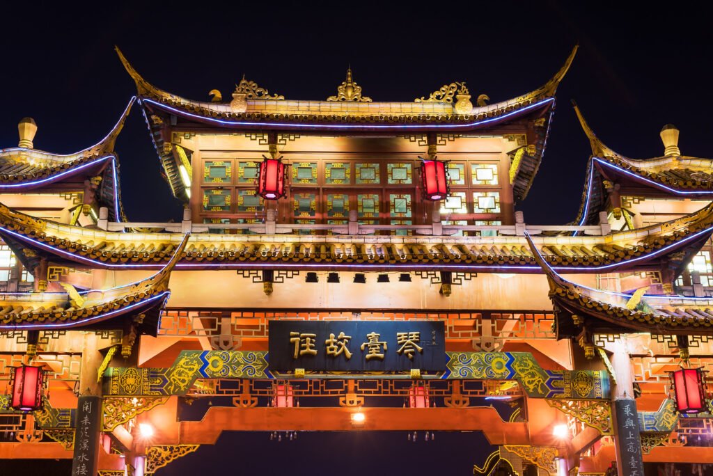 Qintailu chinese traditional gate illuminated at night closeup in Chengdu