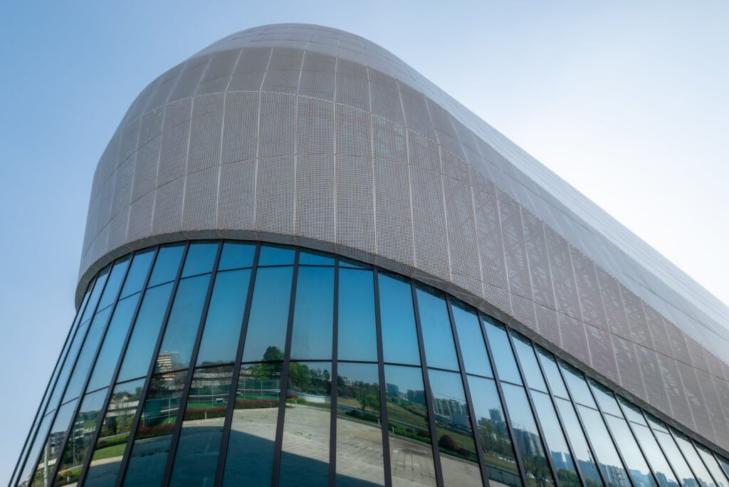 Futuristic architecture of modern building with blue reflective glass windows