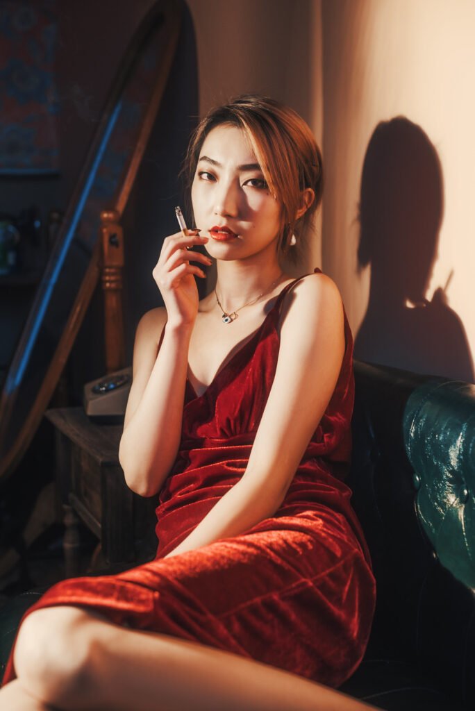 Lady in red dress smoking