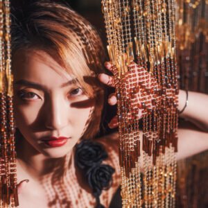 Elegant woman with red lips and black rose