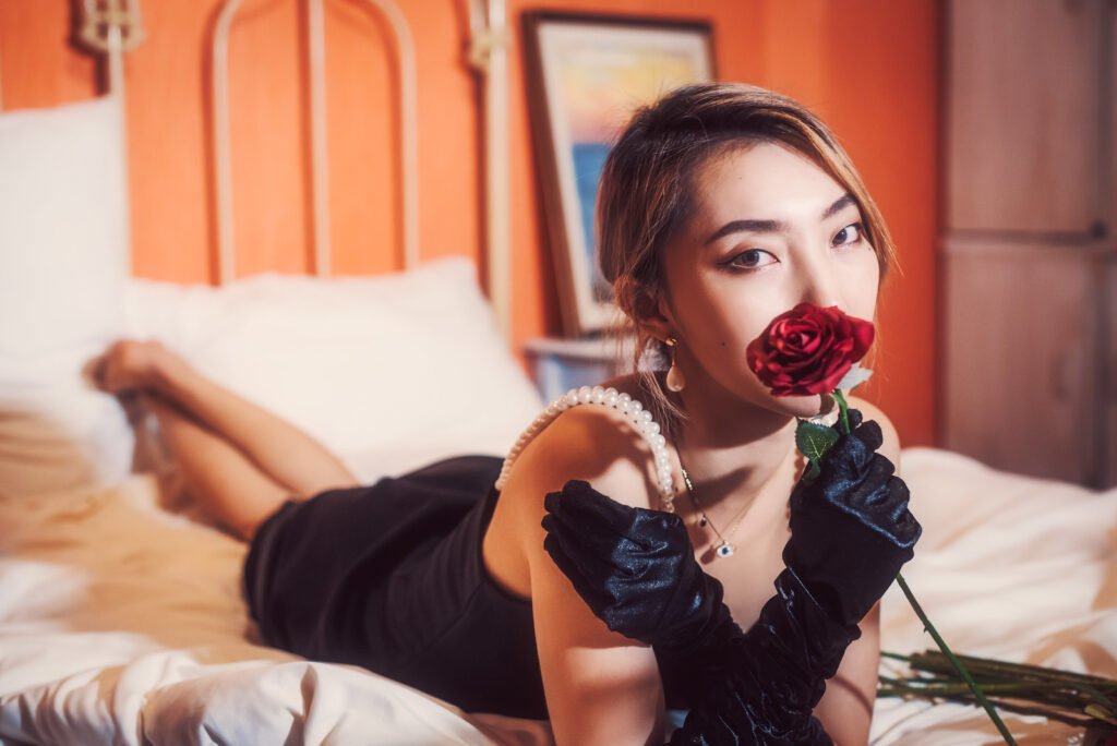 Beautiful woman sleeping on a bed of roses