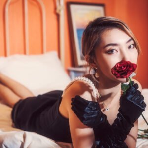 Beautiful woman sleeping on a bed of roses
